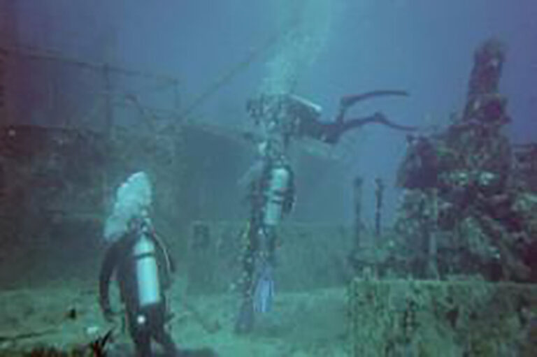 scuba divers at wreck