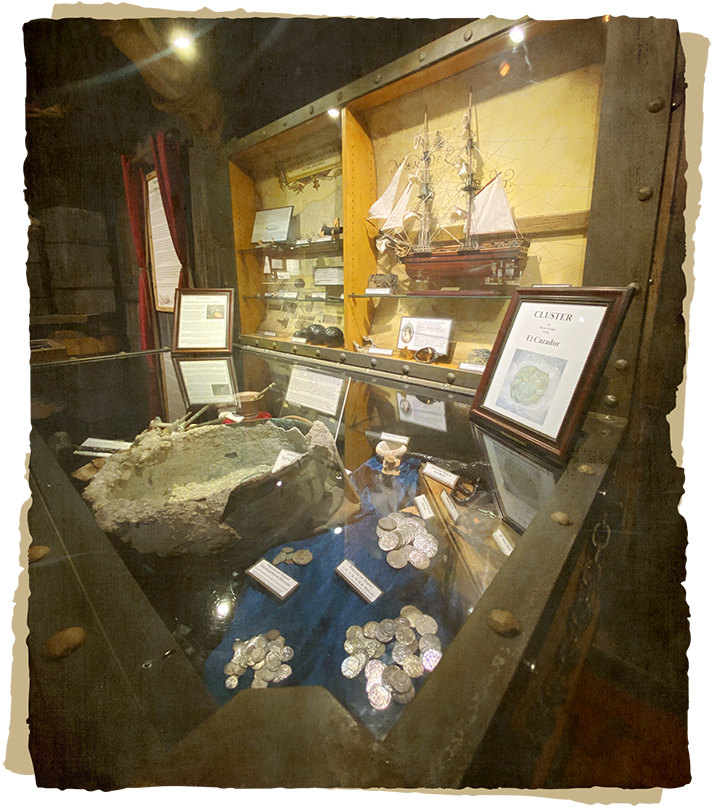 Shipwreck Museum exhibit featuring coins
