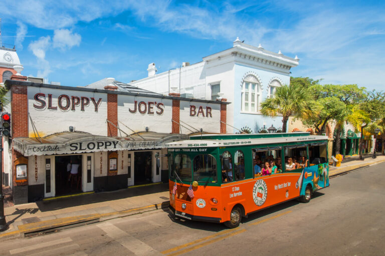 Key West Old Town Trolley driving by Sloppy Joes